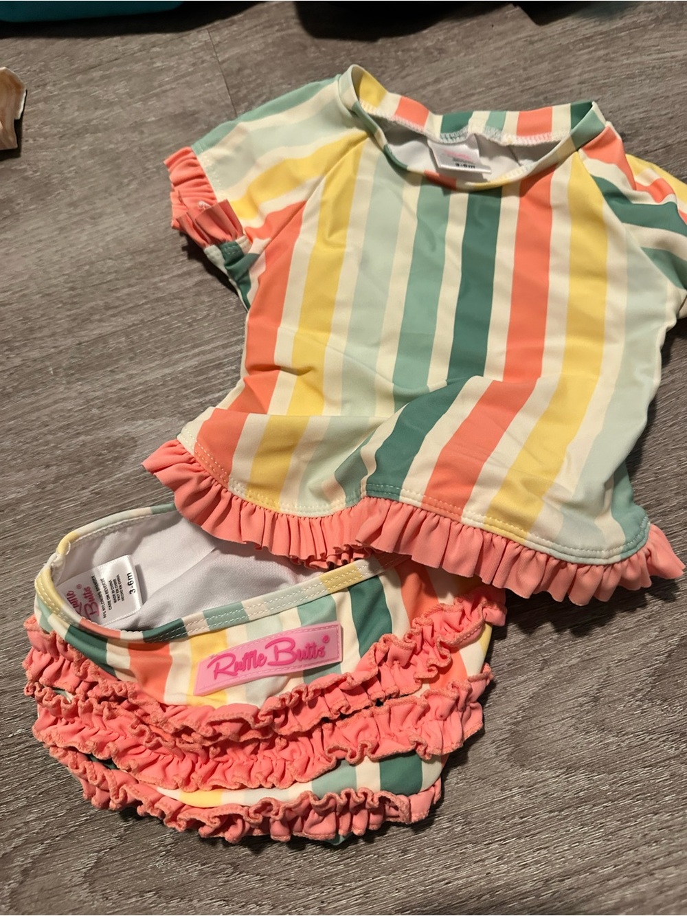 Ruffle Butts Pastel Stripe One-Piece with Coral Ruffle Trim